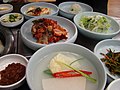 Various banchan including dongchimi and gulkimchi