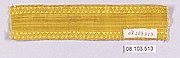 A length of plain, bright gold braid with a zigzag border
