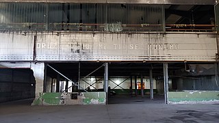 Shades of text at the ancient battery factory at the Memorial Center Srebrenica.jpg