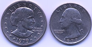 Two coins being shown together as a comparison of their size