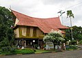 Rumah Lancang or Rumah Lontik with a curved roof and boat-like structure. A Riau Malay traditional house, this is the Riau Pavilion Taman Mini Indonesia theme park.