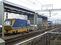 Track maintenance vehicles stabled along sidings outside Kyoto station