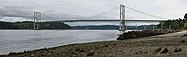 A panorama of Tacoma Narrows Bridge in 2007. This picture was taken at Titlow Hidden Beach.