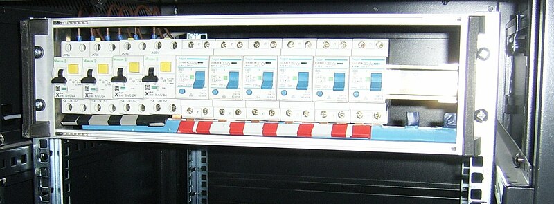 File:DIN rail in rack.jpg