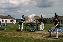 Minnesota Historical Society Historic Interpreters firing a cannon at the fort.