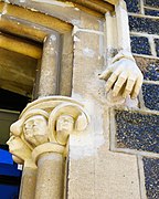 English hands and faces on window surrounds, 2020