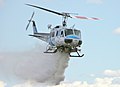 Kern County (California) Fire Department Bell 205 dropping water on fire