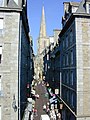 View up a typical city street towards the cathedral