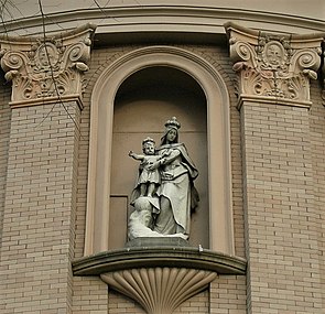 Statue of Mary with the child Jesus on the building's exterior