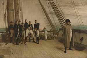 A group of men in military uniform and formal clothes stand to the left, looking towards a single man in a greatcoat and bicorne hat stood by the rail of a ship looking out to sea