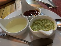 Garlic sauce, green chilli sauce, and ketchup