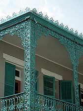 A motif of grapes and vines on the galley of 1127-1129 Chartres Street[2][27]