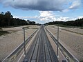 LGV Rhin-RhôneÀ proximité de la bifurcation de la ligne Dijon-Dole sur la commune de Villers-les-Pots. L'ouvrage aperçu au loin est le pont-rail de la ligne Gray-Saint-Jean-de-Losne