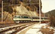 SLM Re 456 locomotive of BT (in green and cream livery) with SOB EW IV coaches near Biberbrugg