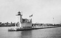 The configuration of the lighthouse from 1912 - 1931, with an open frame tower and the fog signal building behind it. This photo was taken in 1914 when the fog signal was a 10" diameter compressed air whistle