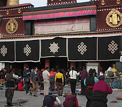 Prayer and prostration in front of the Jokhang.