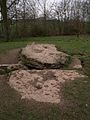 Plates covering the later stone tomb