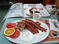 A typical Québécois breakfast, featuring a small pot of fèves au lard as a side.