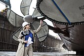 Susan Ford Bales, ship's sponsor for the aircraft carrier USS Gerald R. Ford (CVN-78), tours Dry Dock No. 12 at Newport News Shipbuilding prior to flooding the basin and floating Gerald R. Ford for the first time.