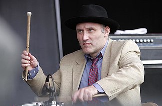 Jah Wobble playing drums.jpg