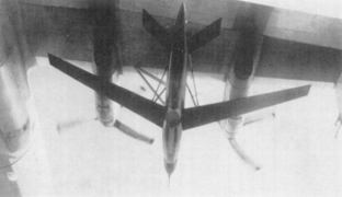 Model 147 RPV pictured in flight under wing pylon of a carrier aircraft.png