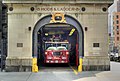 The building's main gate, with a ladder truck inside.