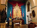 Left side altar. Our Lady of Guadalupe image.