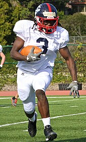 Alex Collins, a running back with the east coast team of the Semper Fidelis All-American Bowl, attempts to spot a hole in the defensive line during the team's first practice on December 31, 2012.