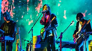 Parker performing in 2019 at Flow Festival with members of the Tame Impala live band