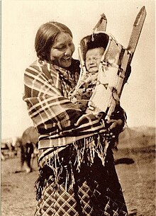 Native American smiling with child.jpg