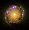 Spiralgalaksen NGC 1512 oven- eller nedenfra. NGC 1512 er 30 millioner lysår væk.[6]