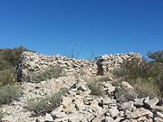 Rocky trail leading to the entrance of a Hohokam house.