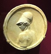 Begram medallion depicting a Greek soldier wearing a Corinthian helmet; c. 1st century AD.