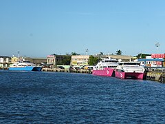 Fast craft ferries from 2GO Travel and Oceanjet at the fast ferry terminal on the Iloilo River, going to Bacolod.