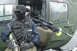 Irish Army Ranger Wing airborne sniper team on a helicopter during the 30th anniversary of the ARW.