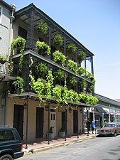 Simple posts on the first floor and more ornate on upper floors[2]