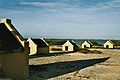Image 7The forced African migrants brought to the Caribbean lived in inhumane conditions. Above are examples of slave huts in Dutch Bonaire. About 5 feet tall and 6 feet wide, between 2 and 3 slaves slept in these after working in nearby salt mines. (from History of the Caribbean)