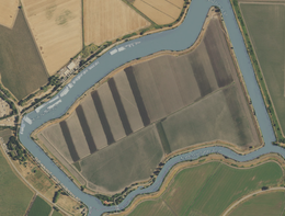 Aerial image of an island. No horses (alive or dead) are visible.