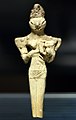 Figurine of a lizard-headed nude woman nursing a child discovered in Ur (dated to the Ubaid V phase c. 4000 BCE). Currently in the Iraq Museum.