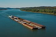 Towboat Dakota Storm upbound on Ohio River at Matthew E. Welsh Bridge (1 of 4), near Mauckport, Indiana, USA, 1987