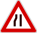 Road narrows on left