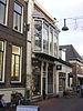 Winkelpand met bovenwoning