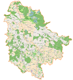 Mapa konturowa powiatu trzebnickiego, po lewej znajduje się punkt z opisem „Pałac w Brzeźnie”