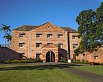 A brick building in a park