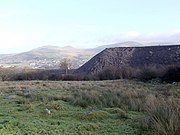 Slate tips on outer edges of Penrhyn Quarry at Mynydd Llandegai, with Bethesda in the distance