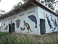 Local artwork on community sports ground building.