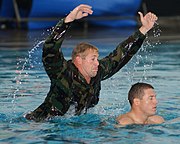 Second Phase A BUD/S instructor attacks a trainee in the pool to simulate a combative drowning victim.