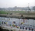 Berlin Wall, eastgerman border guard looks at the Kubat-Dreieck, July 1st 1988