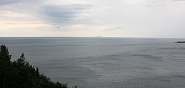 A view of the Cabot Strait from White Point, Cape Breton Island. St. Paul Island is visible in the distance.