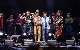 Eraserheads during the Huling El Bimbo concert in 2022. With the four members in the foreground, from left to right: Marcus Adoro, Ely Buendia, Buddy Zabala, and, Raimund Marasigan.
